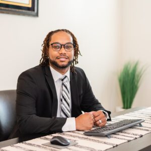 A man wearing a business suit and a tie