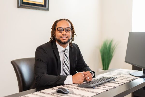 A man wearing a business suit and a tie