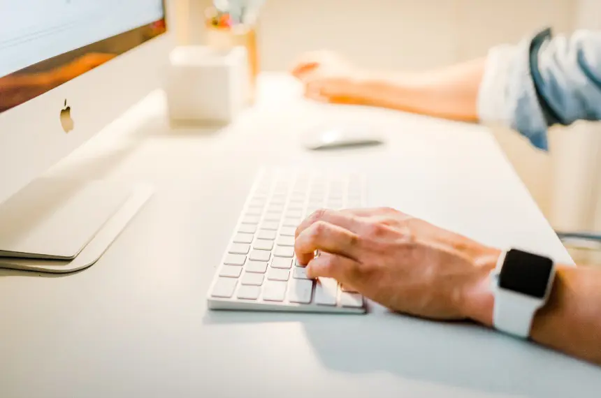 Man typing on computer keyboard